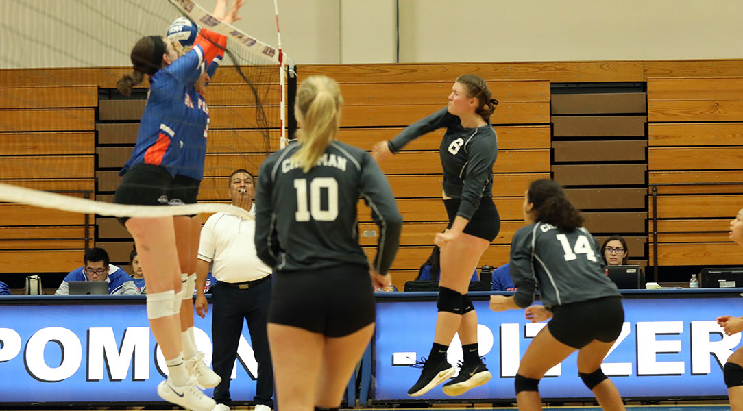 Jessi Lumsden spikes the ball.