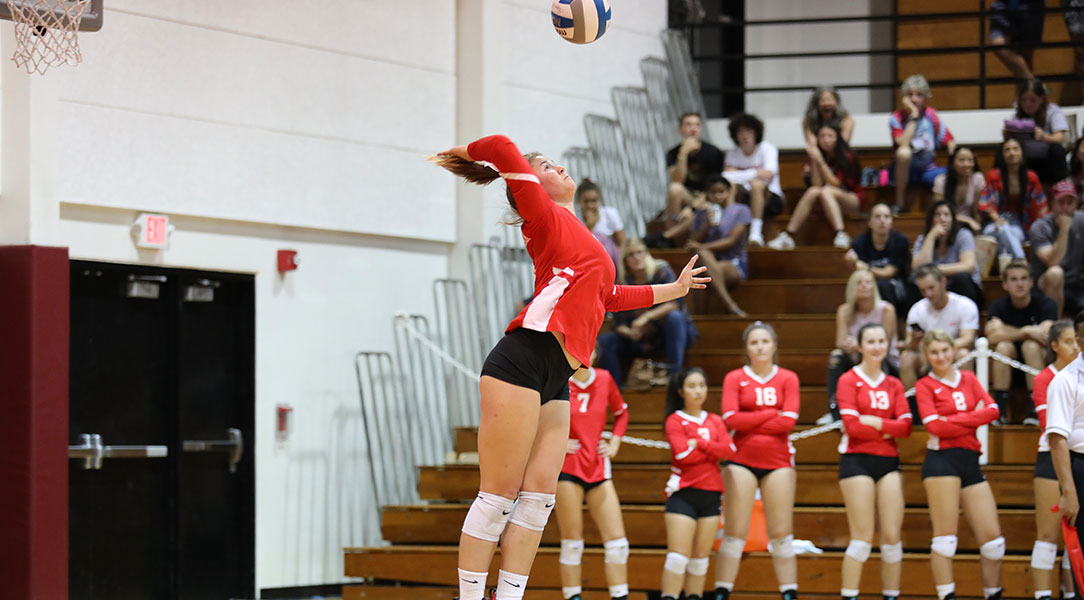 Jessi Lumsden serves the ball.