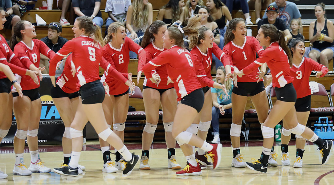 The volleyball team gets fired up before a game.