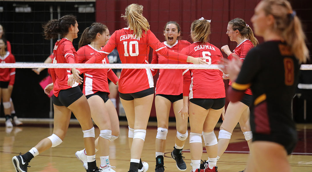 Nayelli Munoz celebrates with teammates after scoring a point.