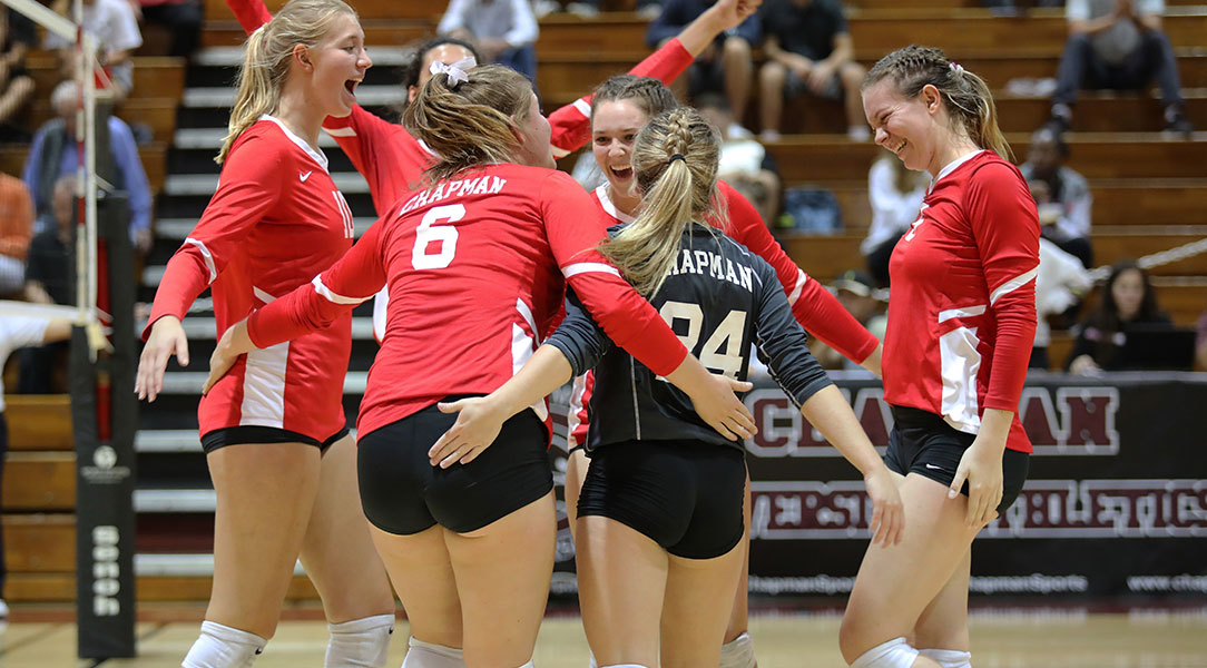 The volleyball team celebrates a point.