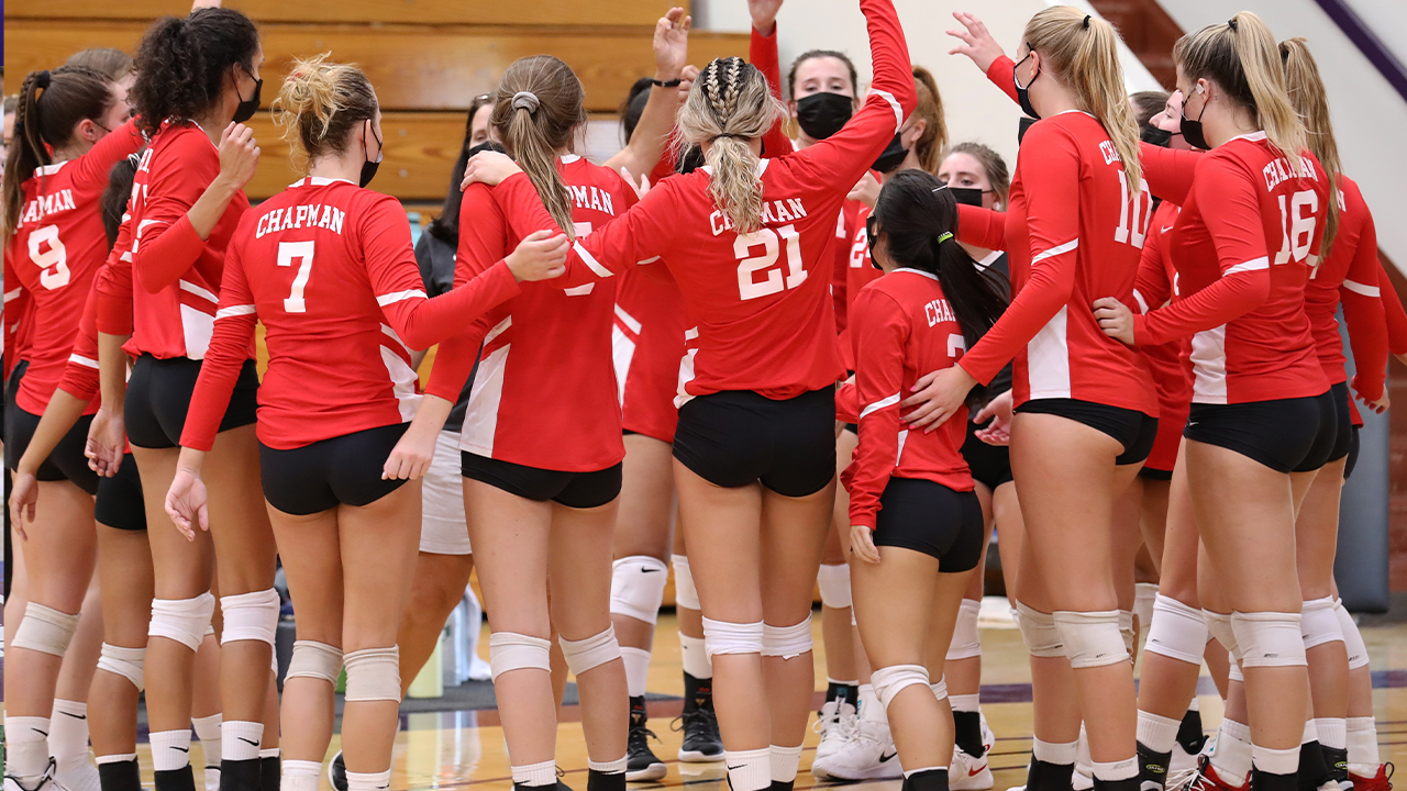 Chapman women's volleyball celebrates in a huddle 