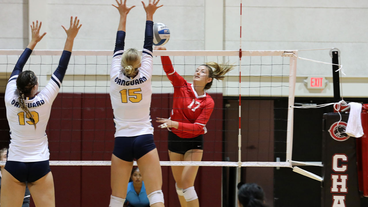 Julin Kenison hits around the blockers across the net. 