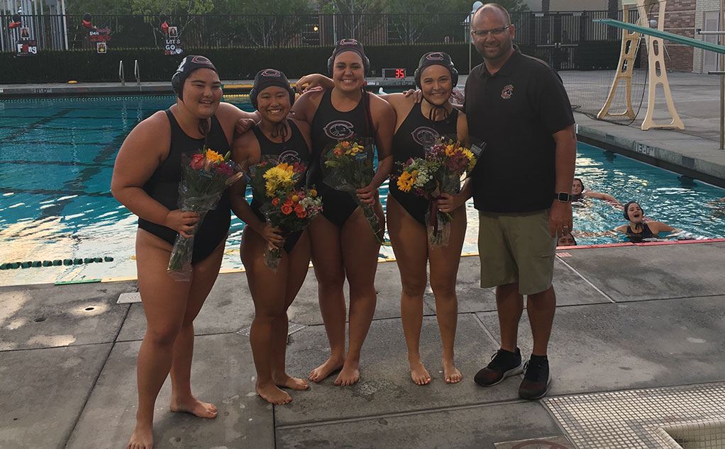 Seniors Emiko Mizusawa, Emily Fong, Lindsey Campbell, and Grace Schade with head coach Eric Ploessel