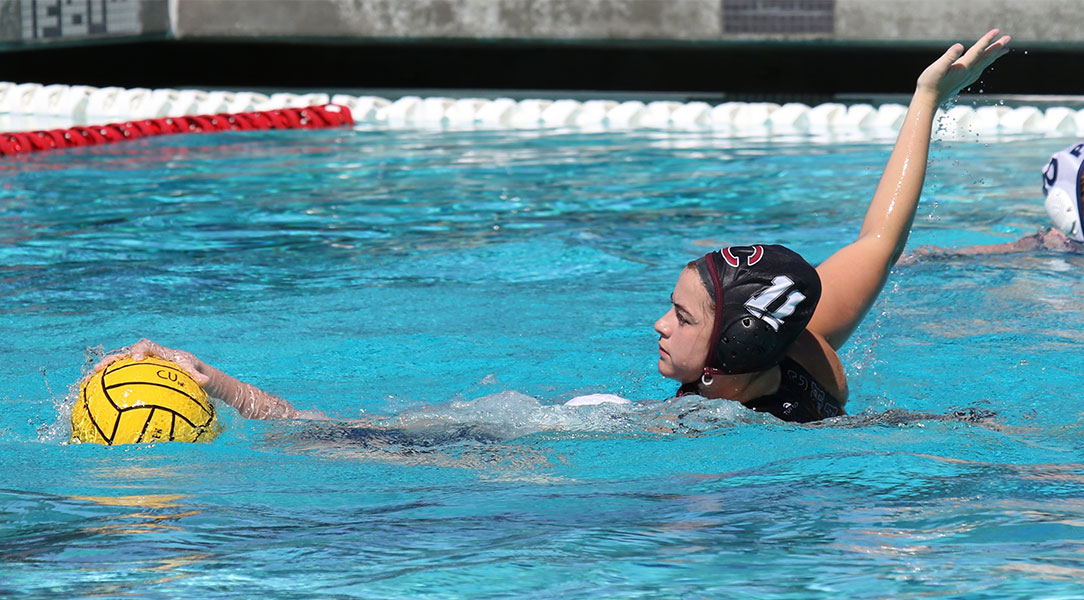 Andi Sandoval closely defends another player.