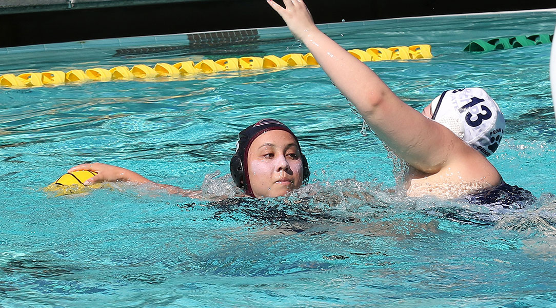 Mary Welton holds off a defender.