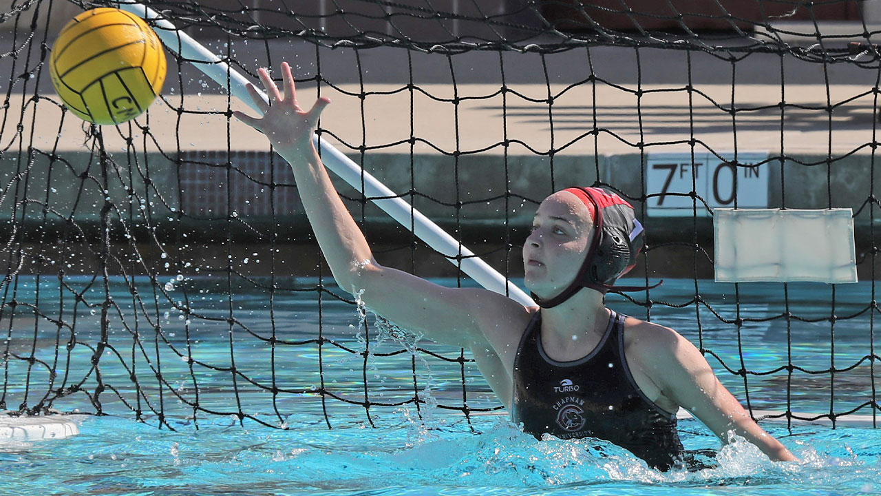 Georgina Burton makes a save with her right hand.