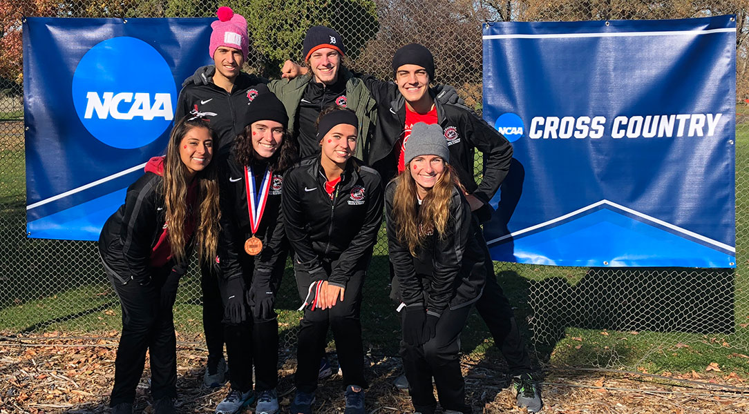 The cross country teams celebrates after Regionals.