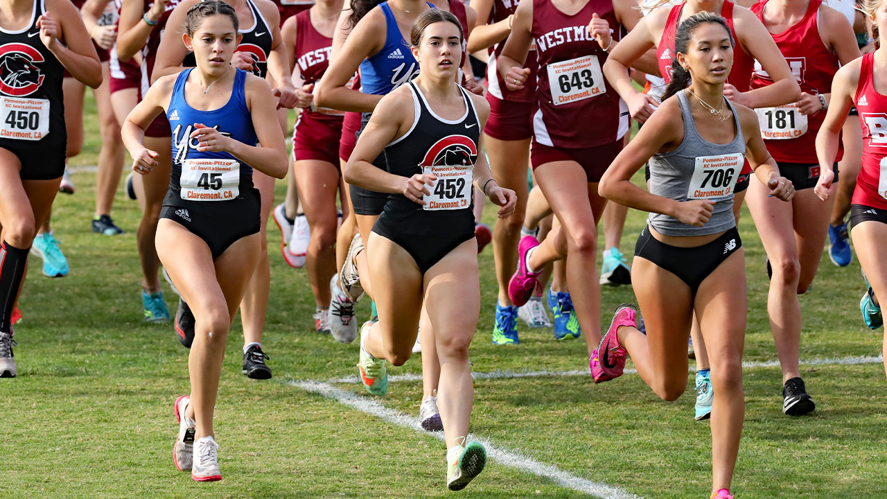 Maddie Mirro runs among a crowd.